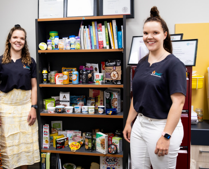 Chloe holding nutrition informational resource