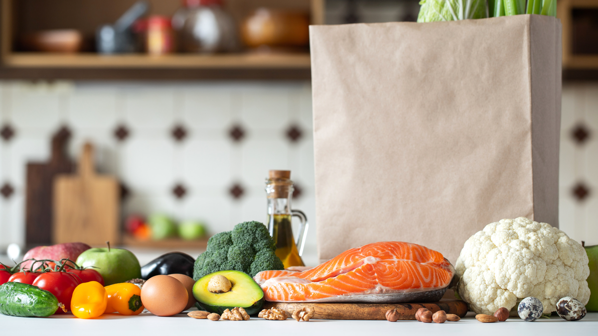 Grocery bag with groceries on bench